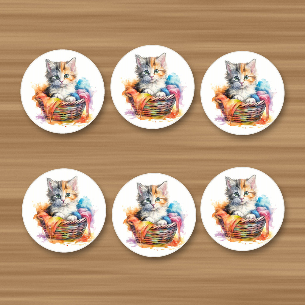 Kitten in a Wool Basket round ceramic coasters, set of 6, on an oak coffee table