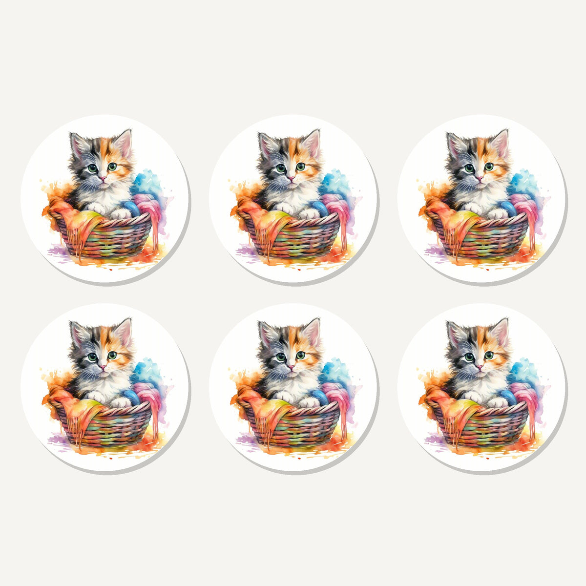 Flat lay of the kitten in a wool basket artwork on six round coasters