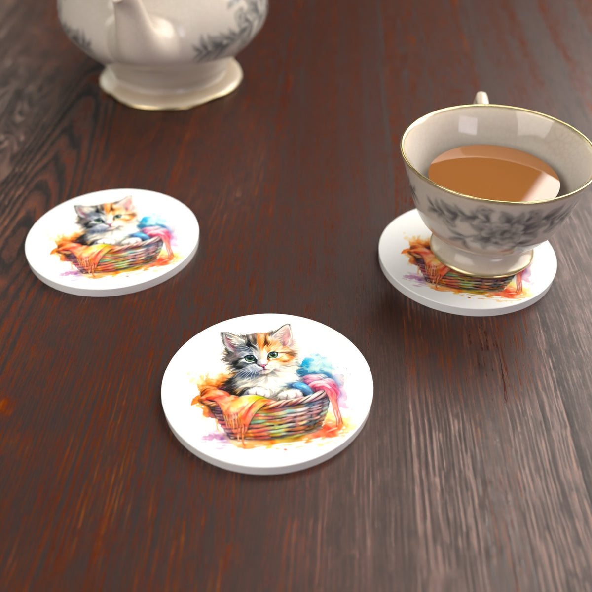 Kitten in a Wool Basket Round Ceramic Coasters – Set of 6 – lifestyle mockup with a teacup