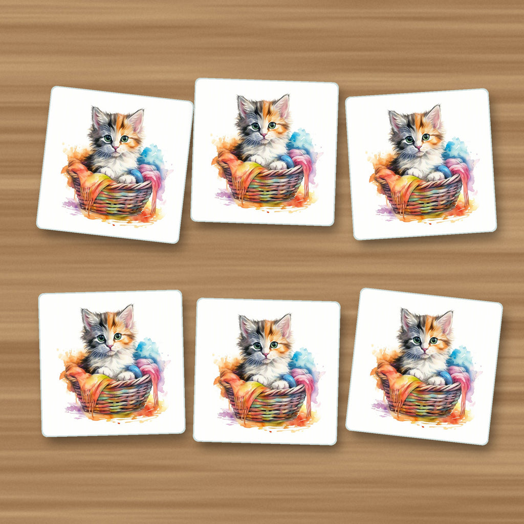 Kitten in a Wool Basket square glass coasters, set of 6, on an oak coffee table