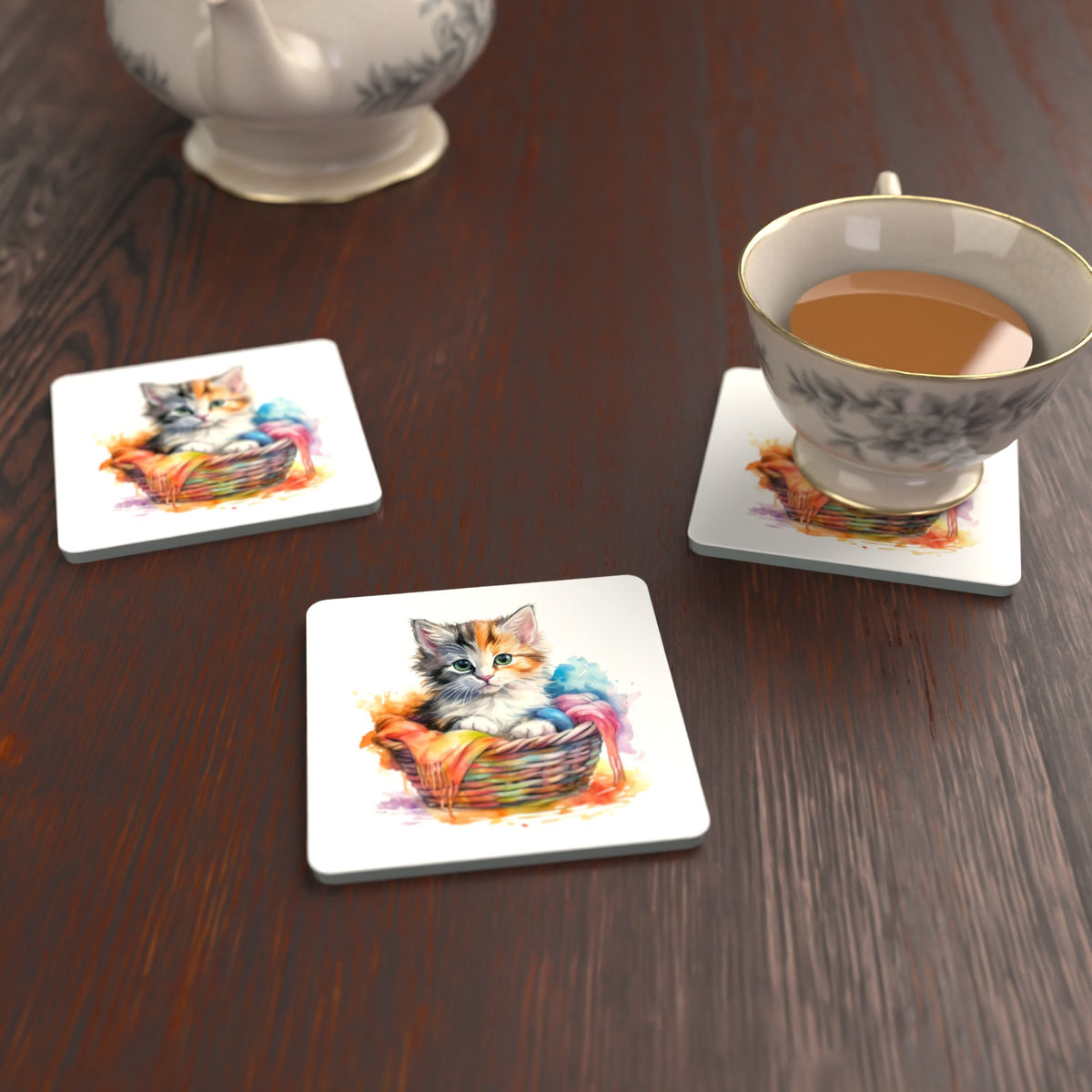 Kitten in a Wool Basket Square Glass Coasters – Set of 6 – lifestyle mockup with a teacup