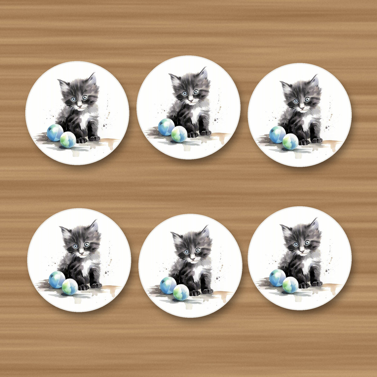 Black & White Kitten with Balls round ceramic coasters, set of 6, on an oak coffee table