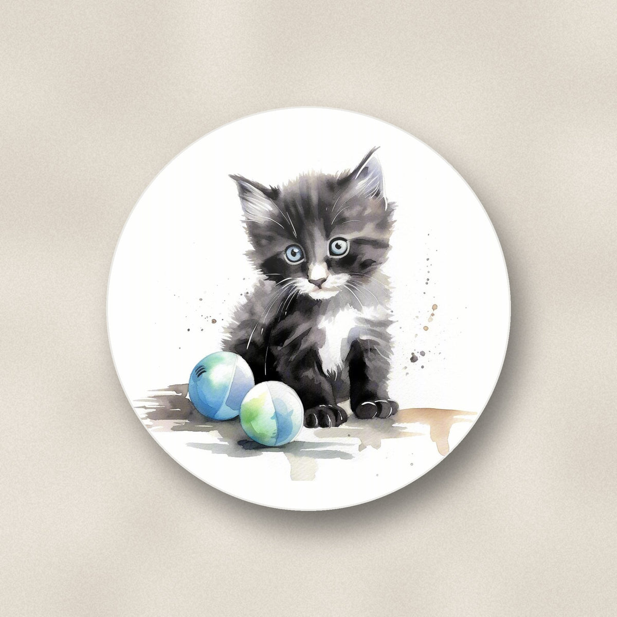 Close-up of one black & white kitten with balls round ceramic coaster, flat UV print
