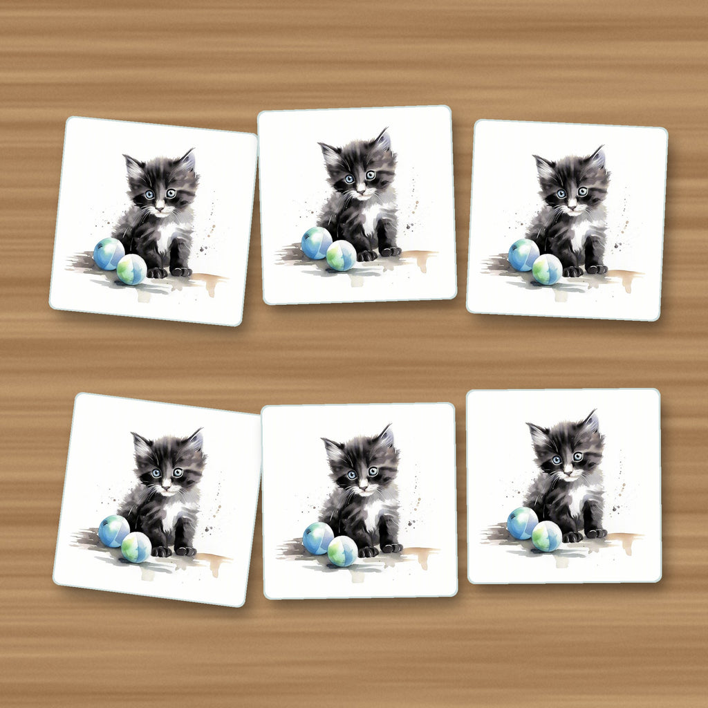 Black & White Kitten with Balls square glass coasters, set of 6, on an oak coffee table