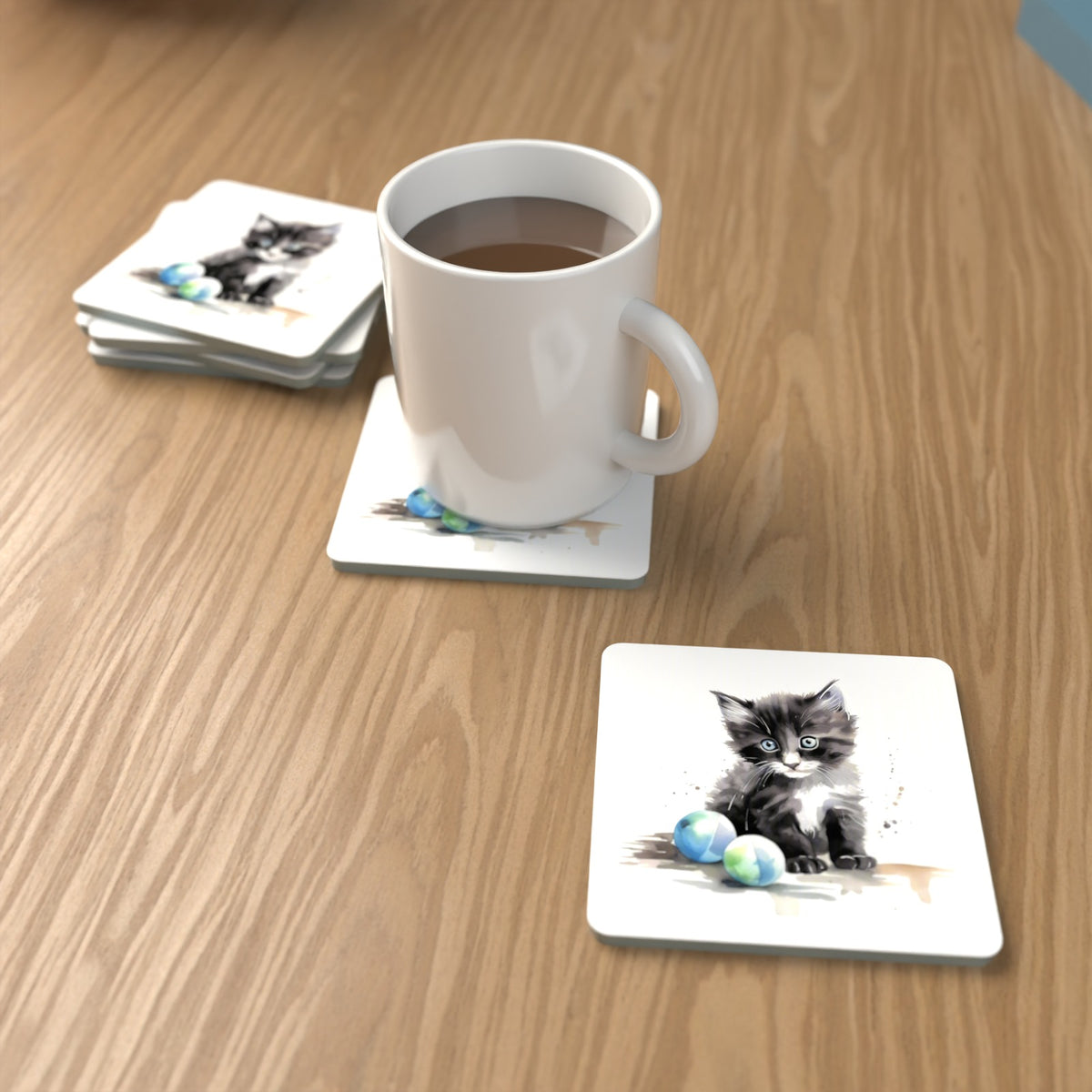 Black & White Kitten with Balls Square Glass Coasters – Set of 6 – lifestyle mockup with a mug of coffee