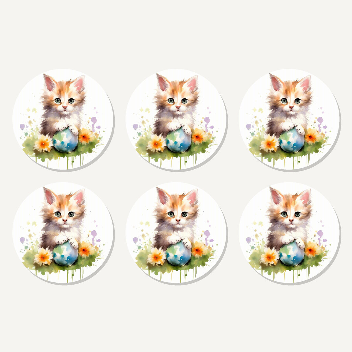 Flat lay of the ginger kitten with flowers & ball artwork on six round coasters
