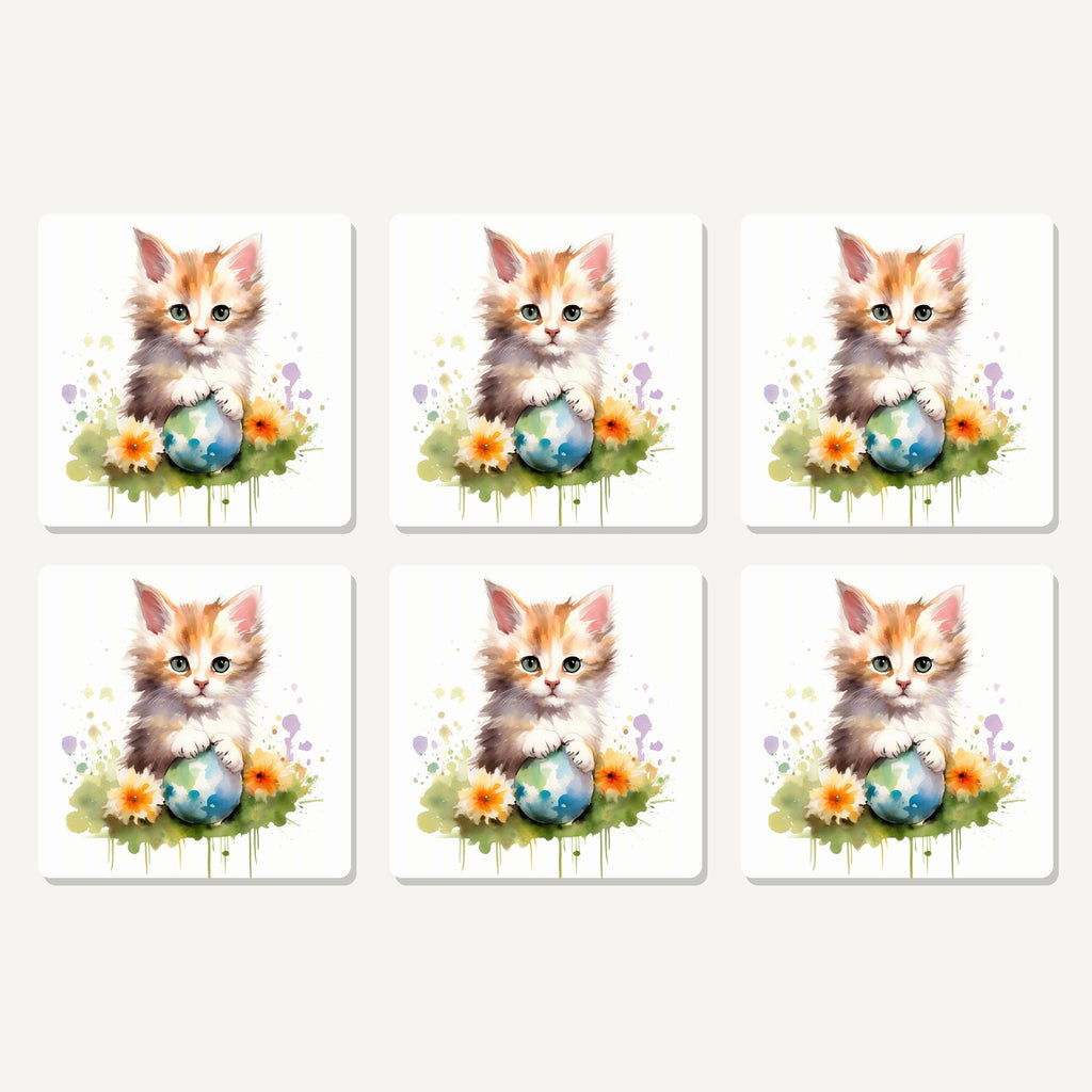 Flat lay of the ginger kitten with flowers & ball artwork on six square coasters
