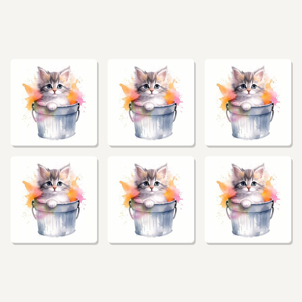 Flat lay of the kitten in a tin bucket artwork on six square coasters