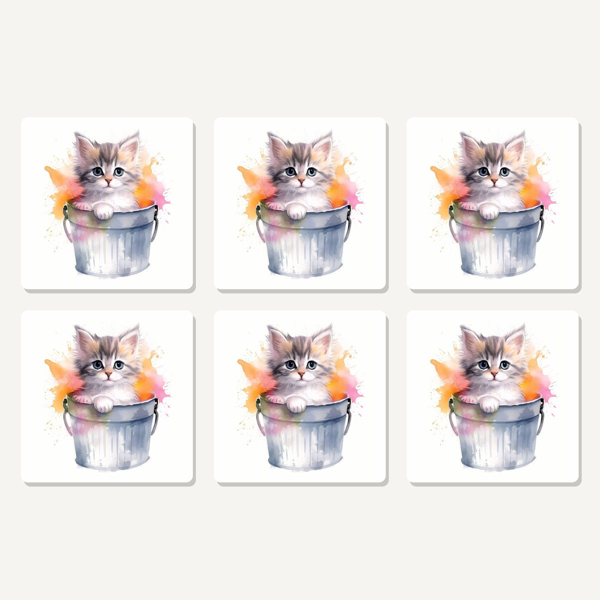 Flat lay of the kitten in a tin bucket artwork on six square coasters