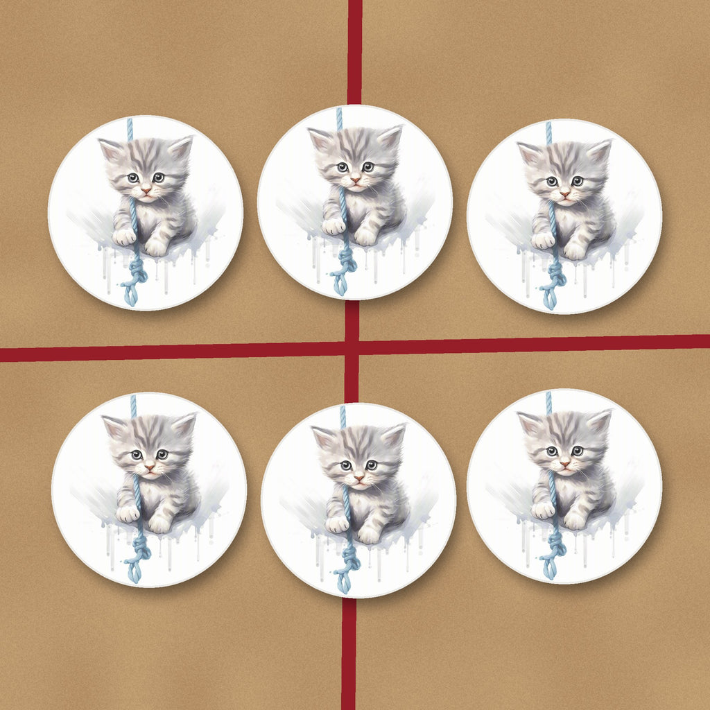 Grey Tabby Kitten on a Rope round ceramic coasters on kraft gift wrap