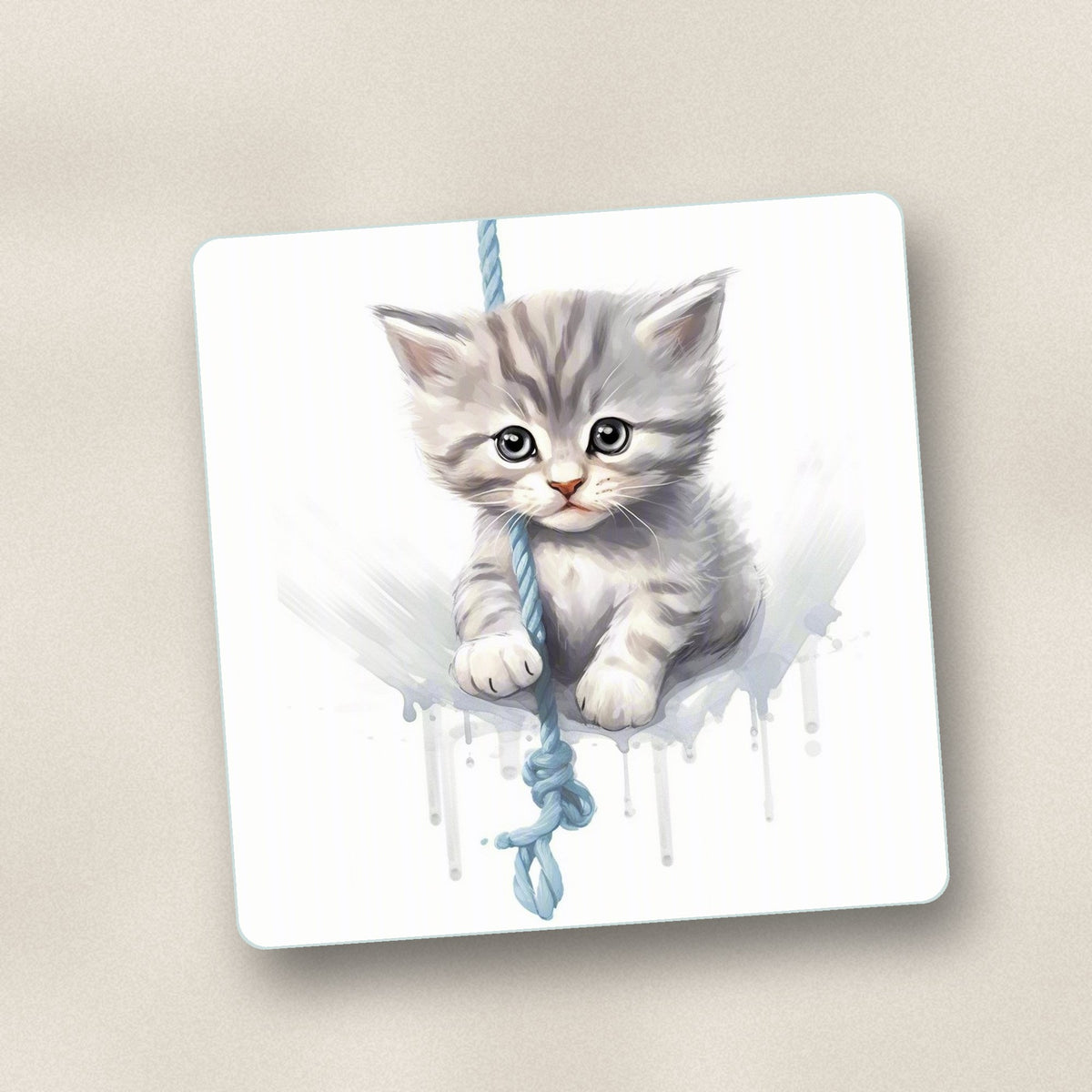 Close-up of one grey tabby kitten on a rope square glass coaster, flat UV print