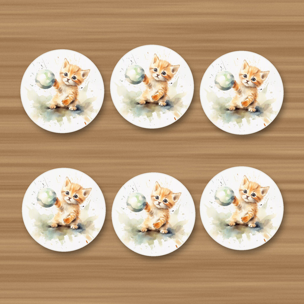 Ginger Kitten Playing with a Ball round ceramic coasters, set of 6, on an oak coffee table