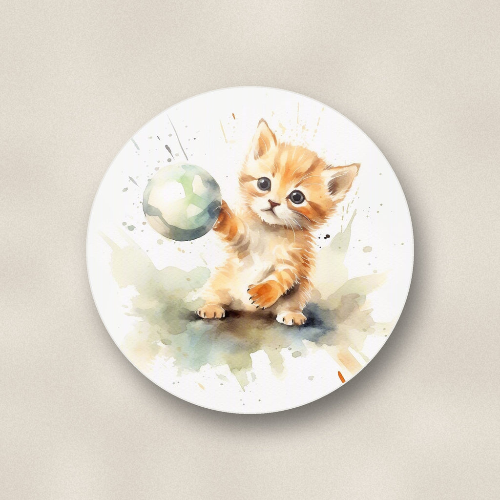 Close-up of one ginger kitten playing with a ball round ceramic coaster, flat UV print