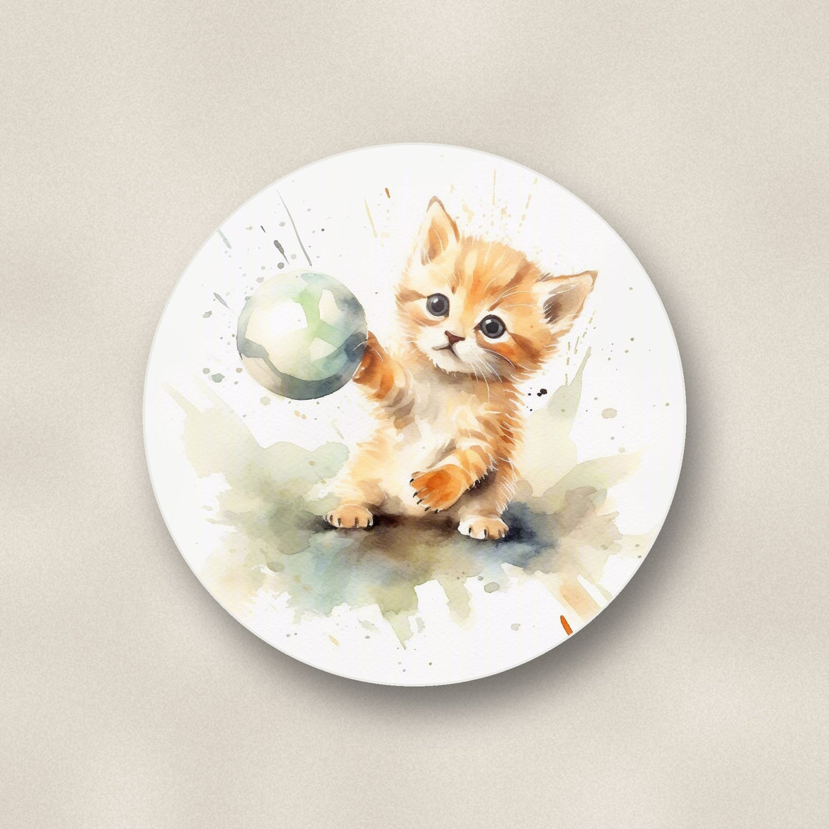 Close-up of one ginger kitten playing with a ball round ceramic coaster, flat UV print