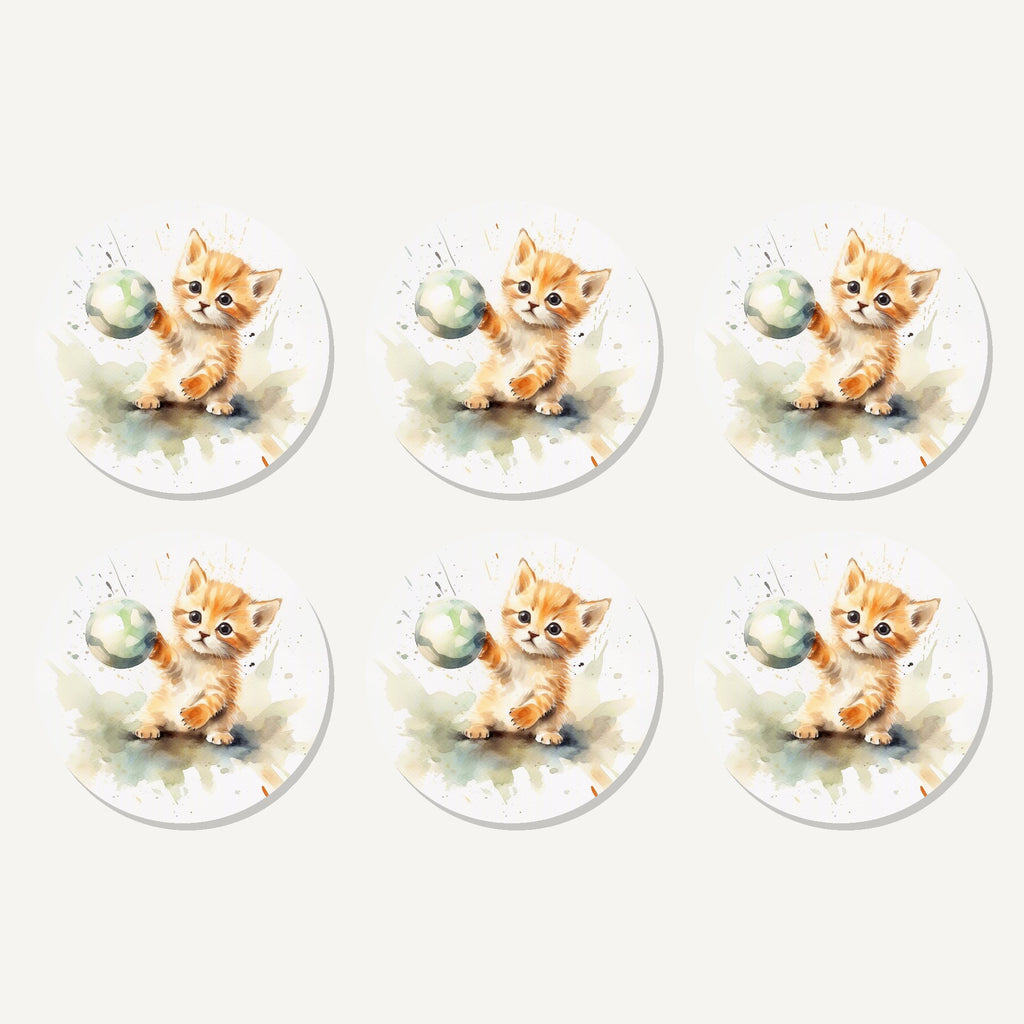Flat lay of the ginger kitten playing with a ball artwork on six round coasters