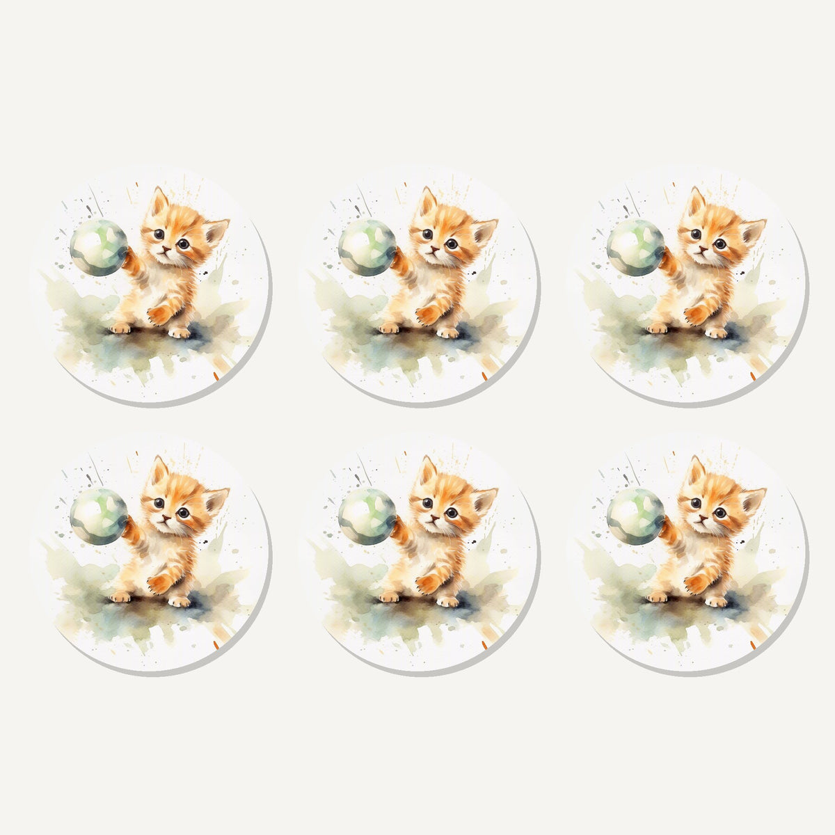 Flat lay of the ginger kitten playing with a ball artwork on six round coasters