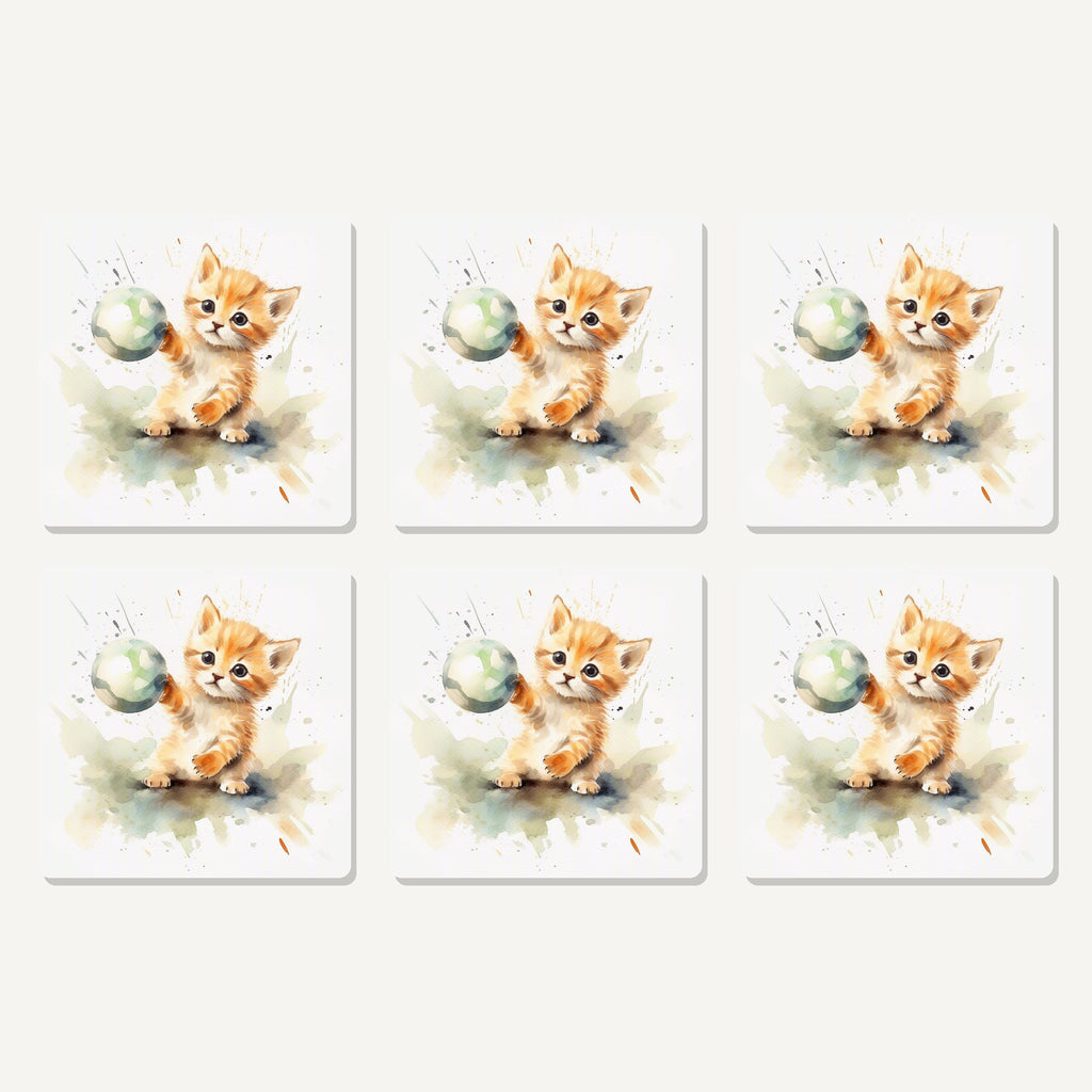 Flat lay of the ginger kitten playing with a ball artwork on six square coasters