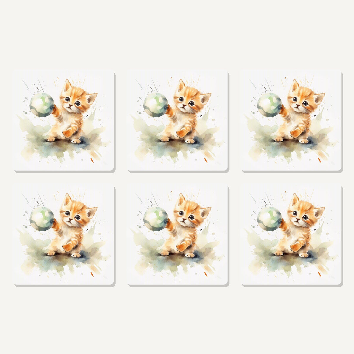 Flat lay of the ginger kitten playing with a ball artwork on six square coasters