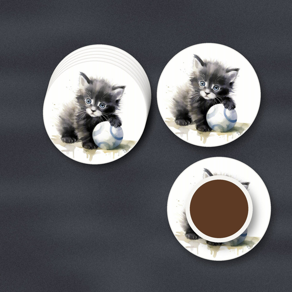 Black Kitten with a Ball round ceramic coasters stacked on a slate kitchen worktop