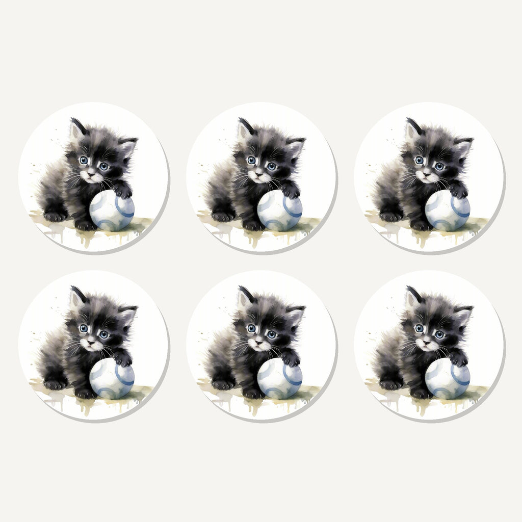 Flat lay of the black kitten with a ball artwork on six round coasters