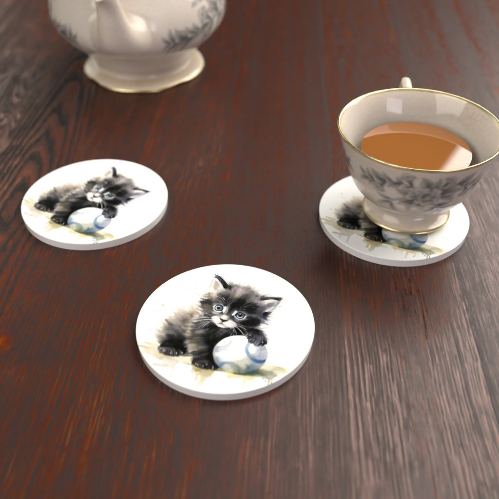 Black Kitten with a Ball Round Ceramic Coasters – Set of 6 – lifestyle mockup with a teacup
