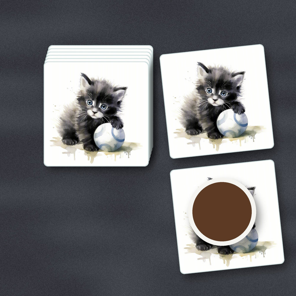 Black Kitten with a Ball square glass coasters stacked on a slate kitchen worktop
