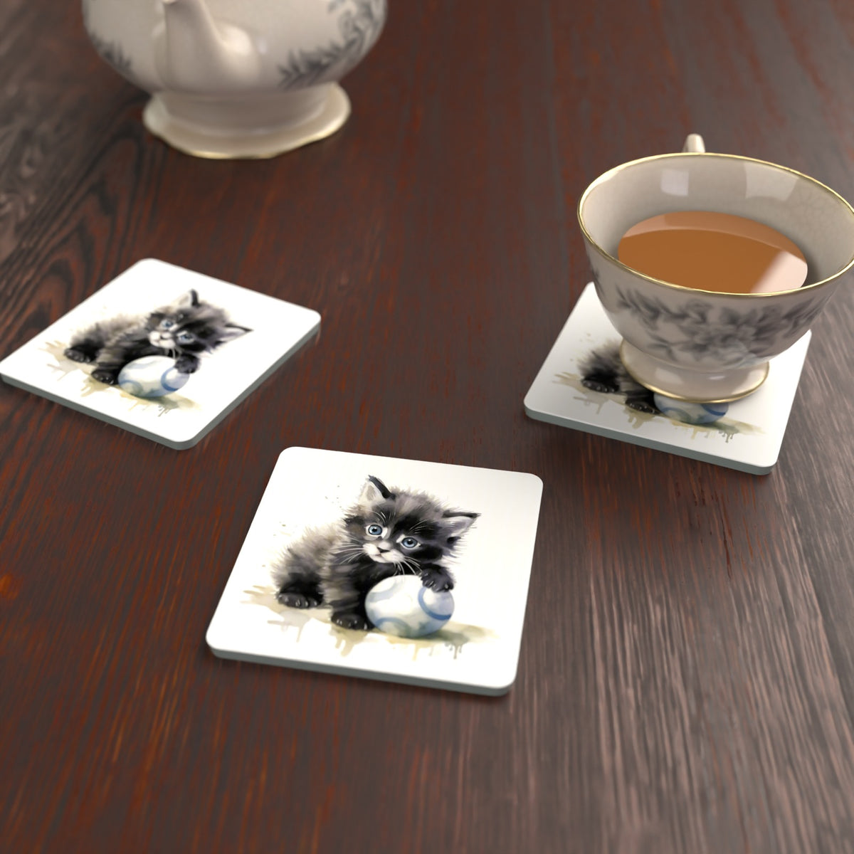 Black Kitten with a Ball Square Glass Coasters – Set of 6 – lifestyle mockup with a teacup