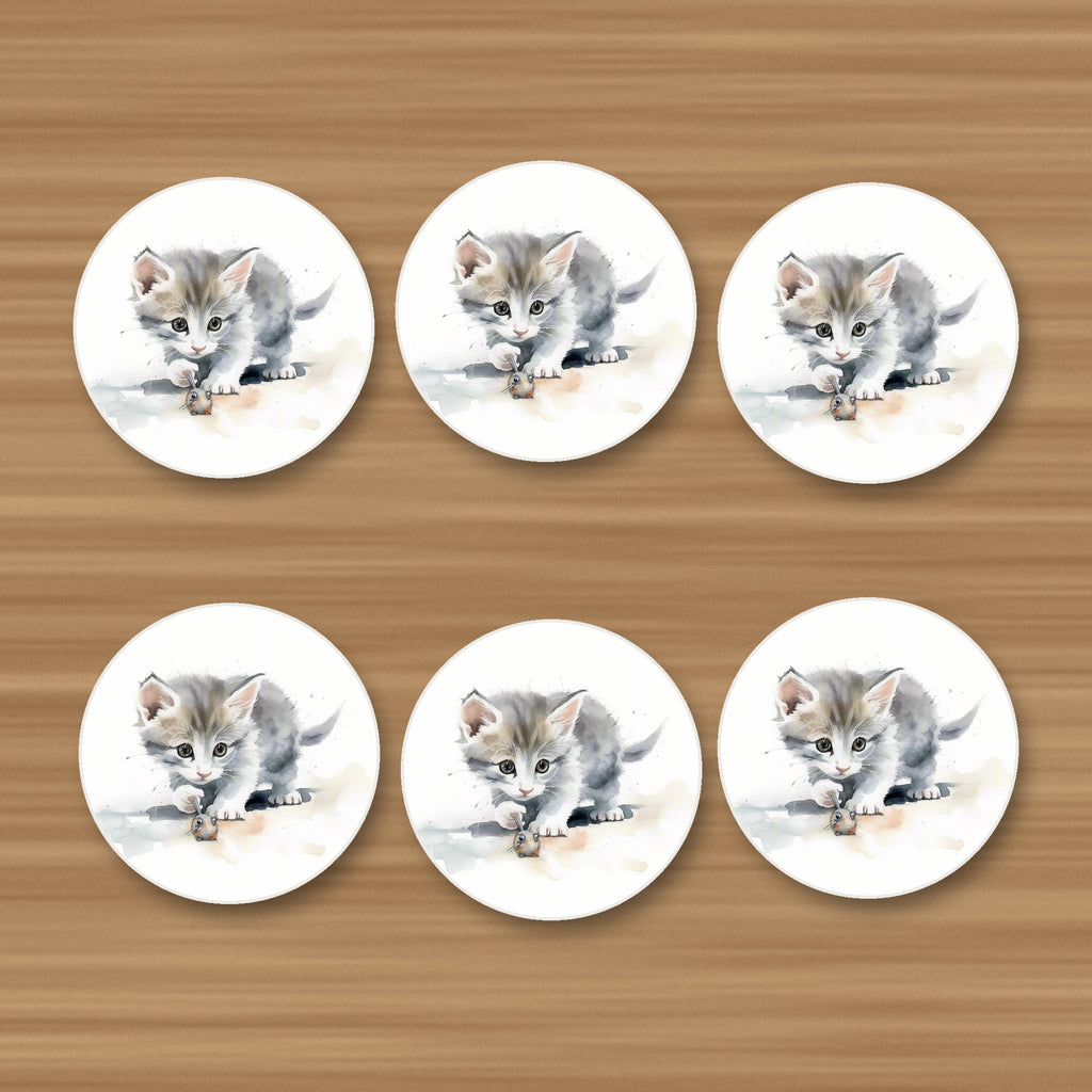 Grey Kitten at Play round ceramic coasters, set of 6, on an oak coffee table