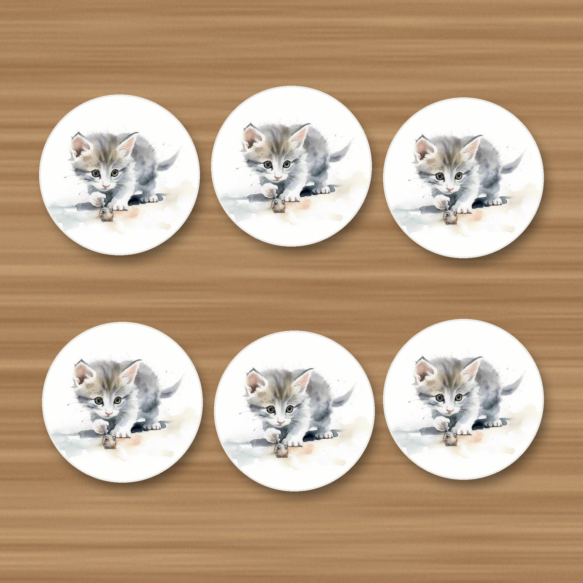 Grey Kitten at Play round ceramic coasters, set of 6, on an oak coffee table