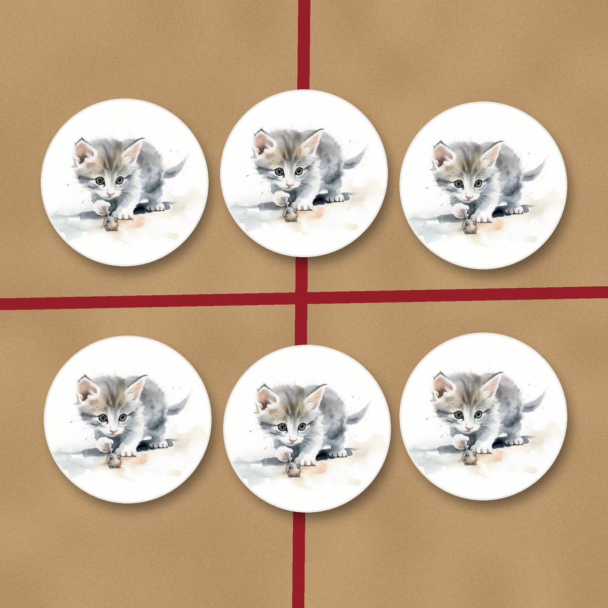 Grey Kitten at Play round ceramic coasters on kraft gift wrap