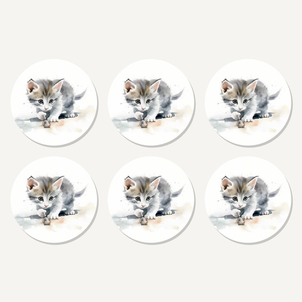 Flat lay of the grey kitten at play artwork on six round coasters