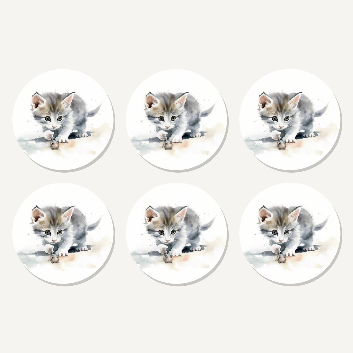 Flat lay of the grey kitten at play artwork on six round coasters