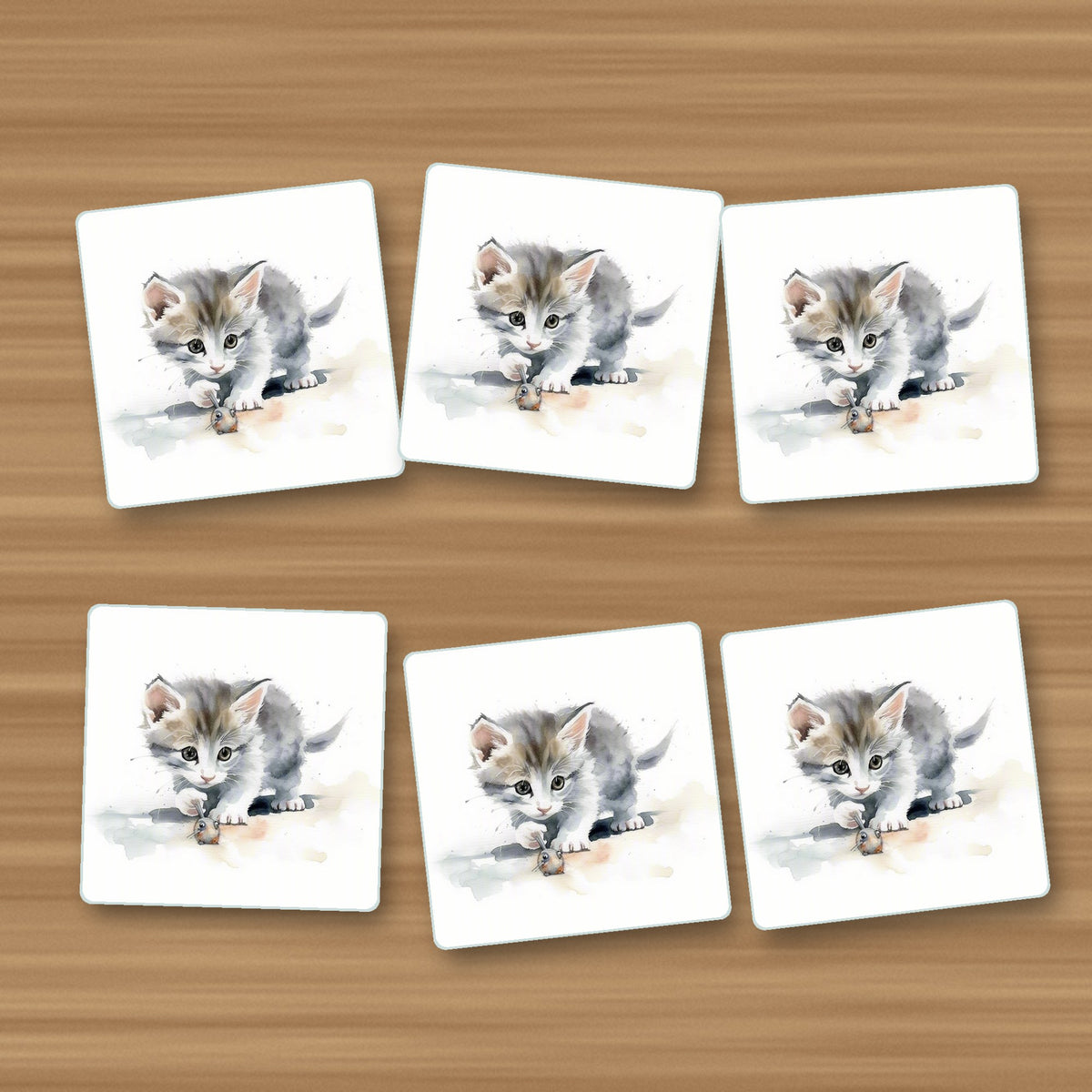 Grey Kitten at Play square glass coasters, set of 6, on an oak coffee table