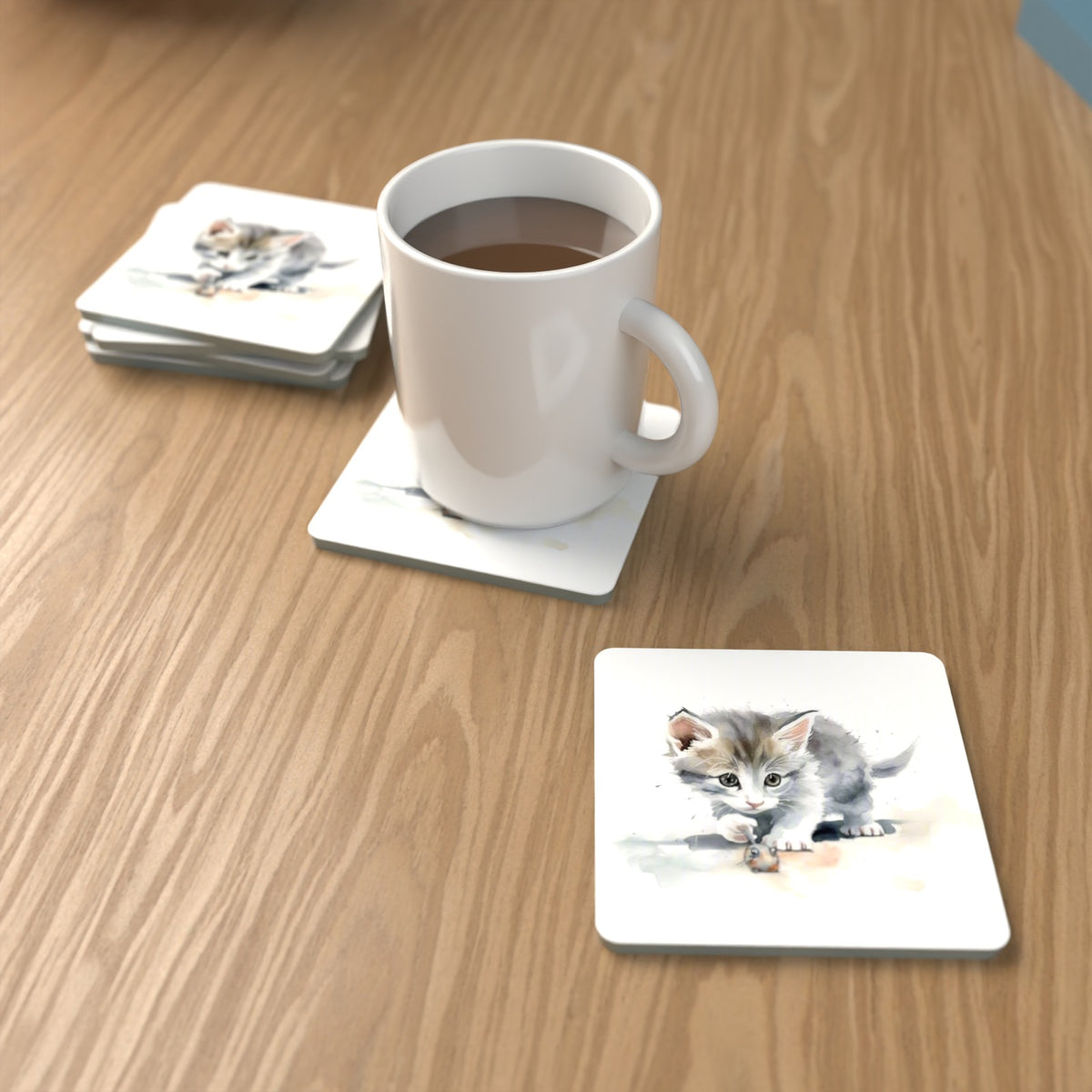 Grey Kitten at Play Square Glass Coasters – Set of 6 – lifestyle mockup with a mug of coffee