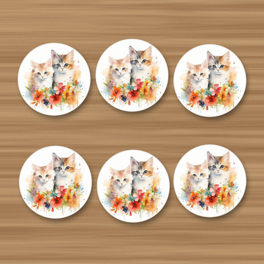 Two Kittens with Flowers round ceramic coasters, set of 6, on an oak coffee table