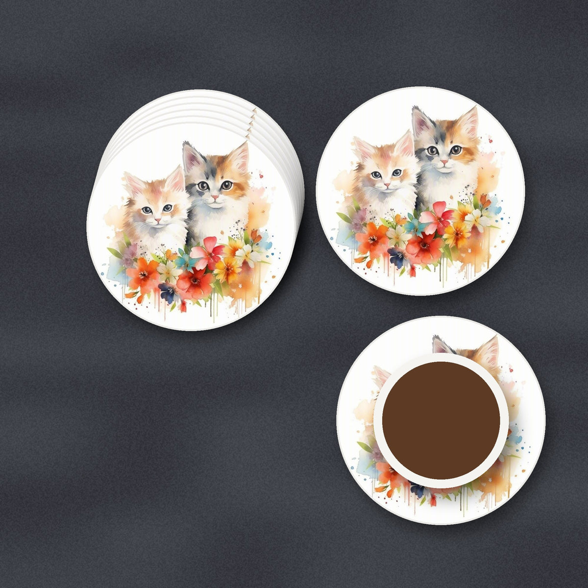 Two Kittens with Flowers round ceramic coasters stacked on a slate kitchen worktop