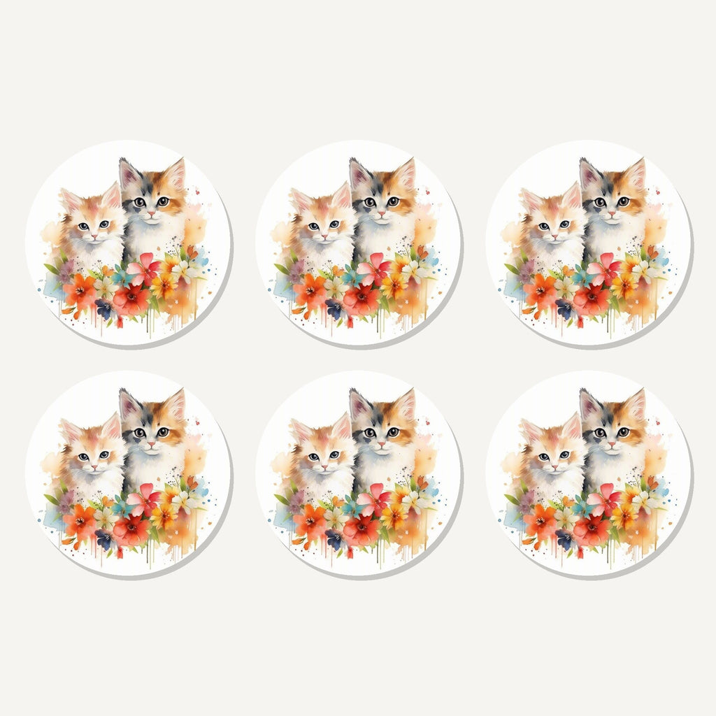 Flat lay of the two kittens with flowers artwork on six round coasters