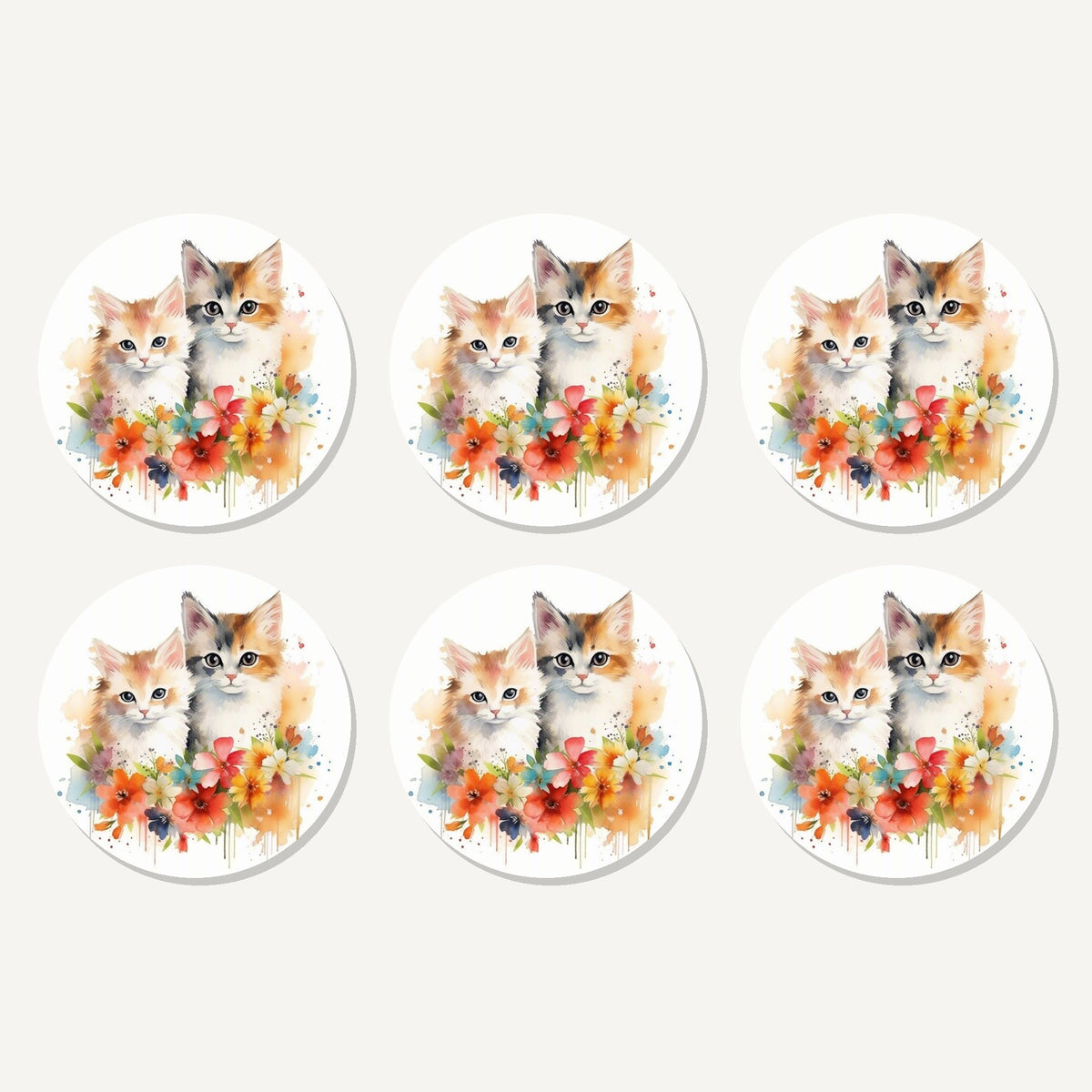 Flat lay of the two kittens with flowers artwork on six round coasters