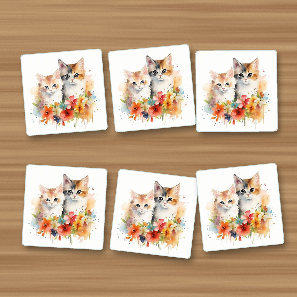 Two Kittens with Flowers square glass coasters, set of 6, on an oak coffee table