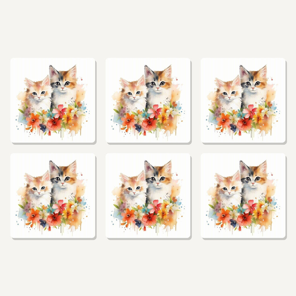 Flat lay of the two kittens with flowers artwork on six square coasters