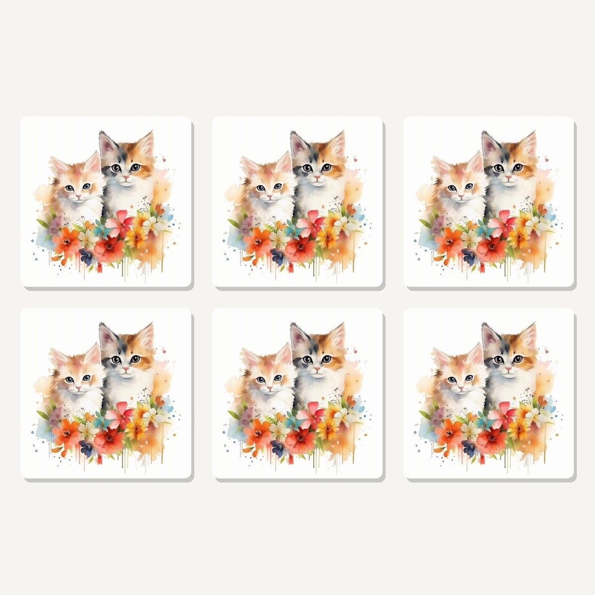 Flat lay of the two kittens with flowers artwork on six square coasters
