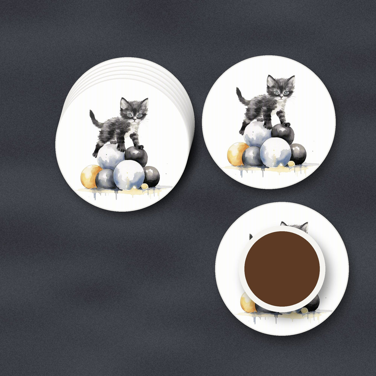 Black Kitten on a Pile of Balls round ceramic coasters stacked on a slate kitchen worktop