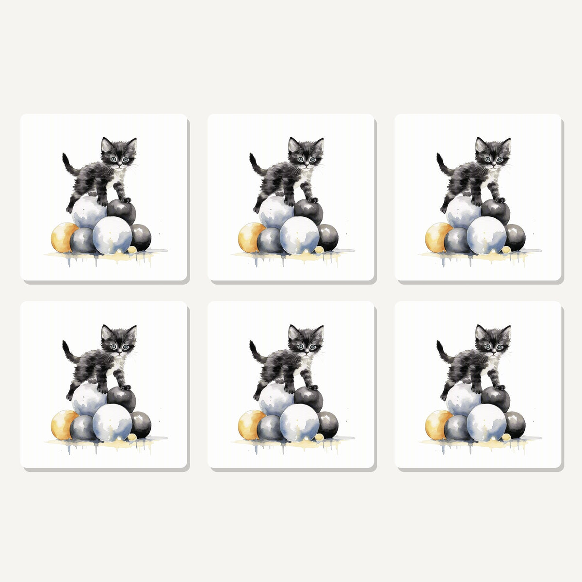Flat lay of the black kitten on a pile of balls artwork on six square coasters