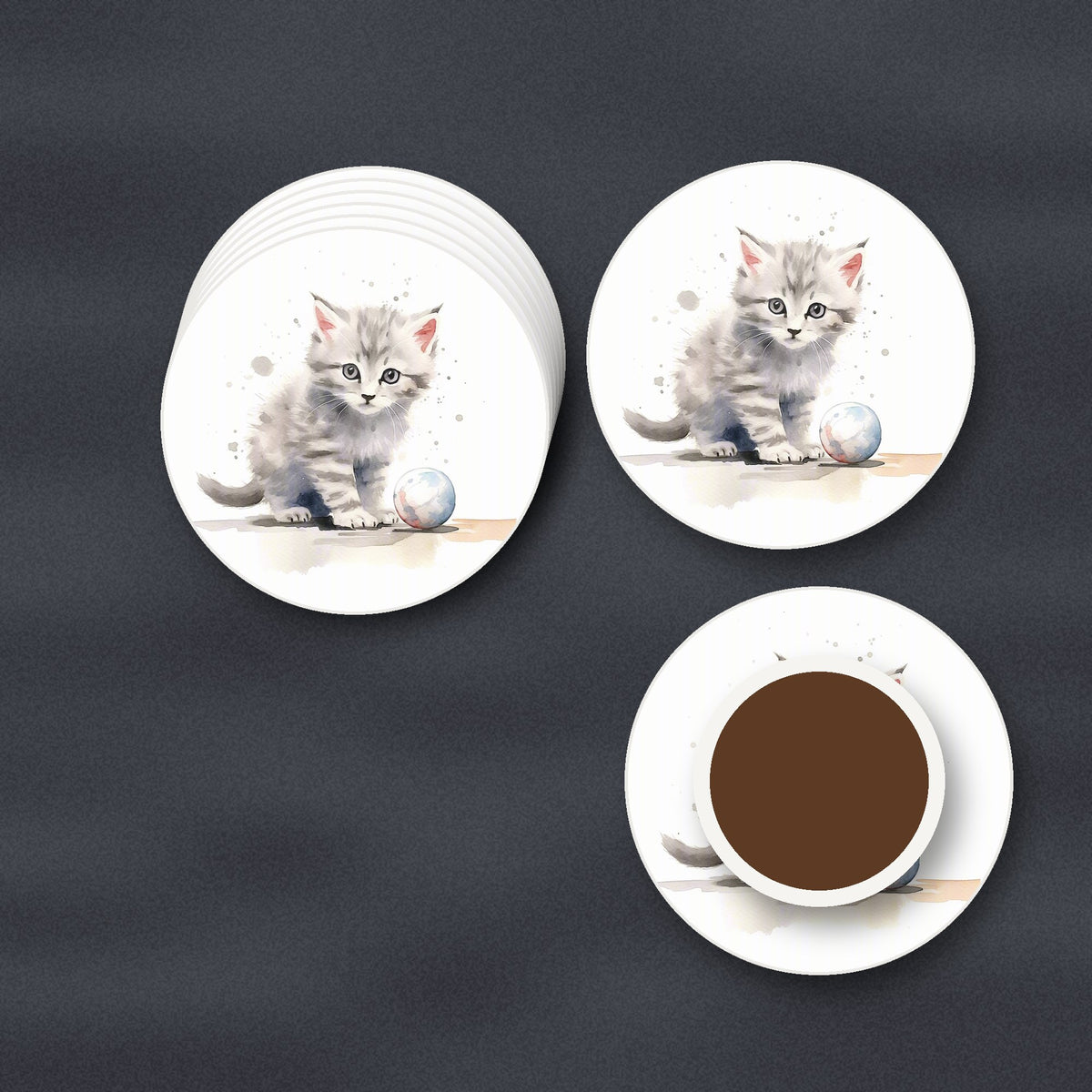 Grey Tabby Kitten with a Ball round ceramic coasters stacked on a slate kitchen worktop