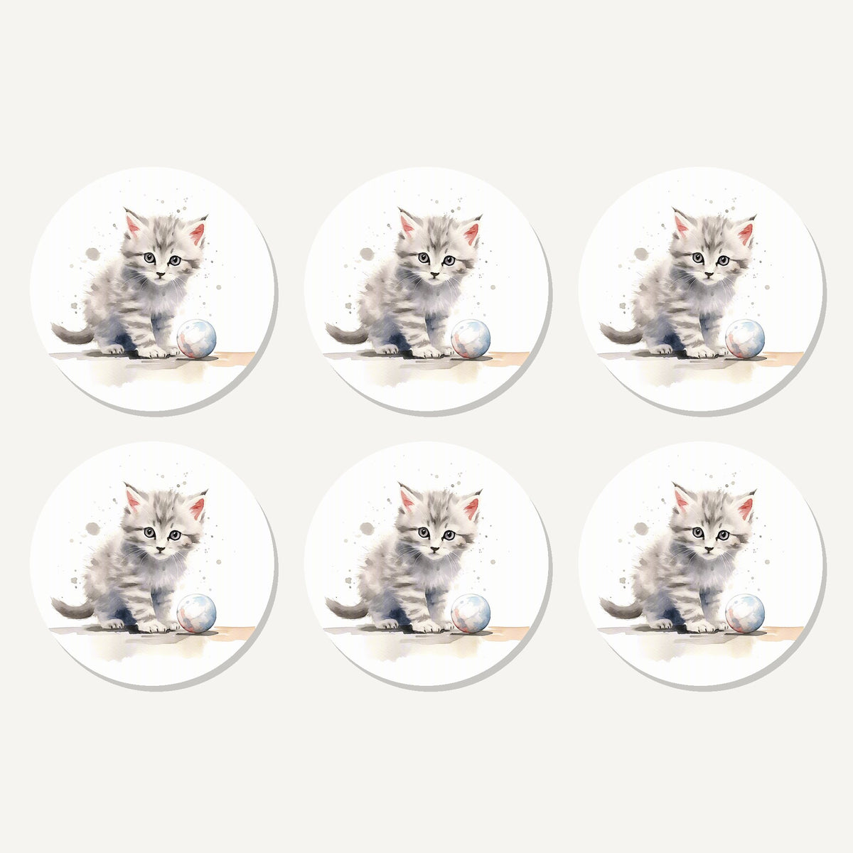 Flat lay of the grey tabby kitten with a ball artwork on six round coasters