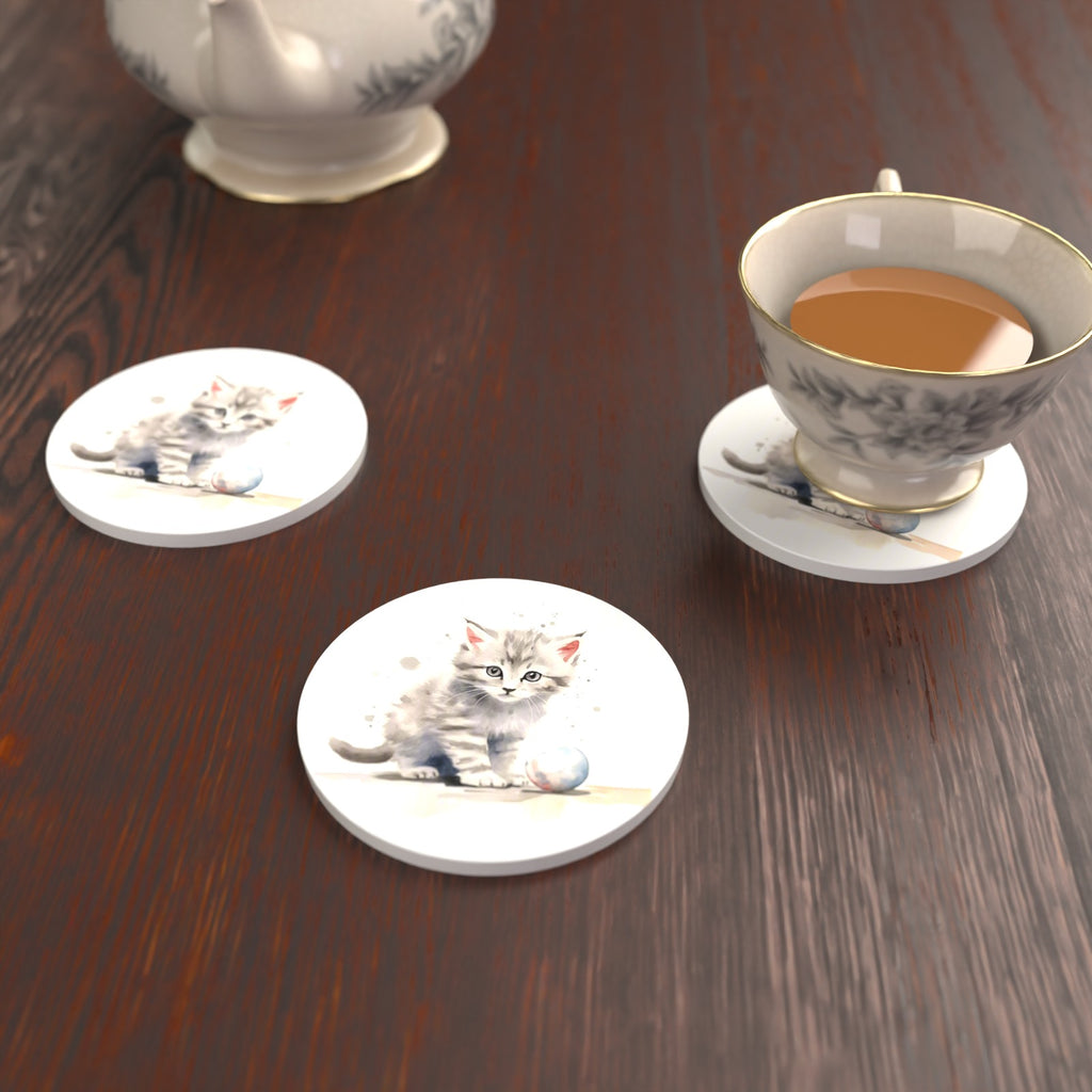 Grey Tabby Kitten with a Ball Round Ceramic Coasters – Set of 6 – lifestyle mockup with a teacup