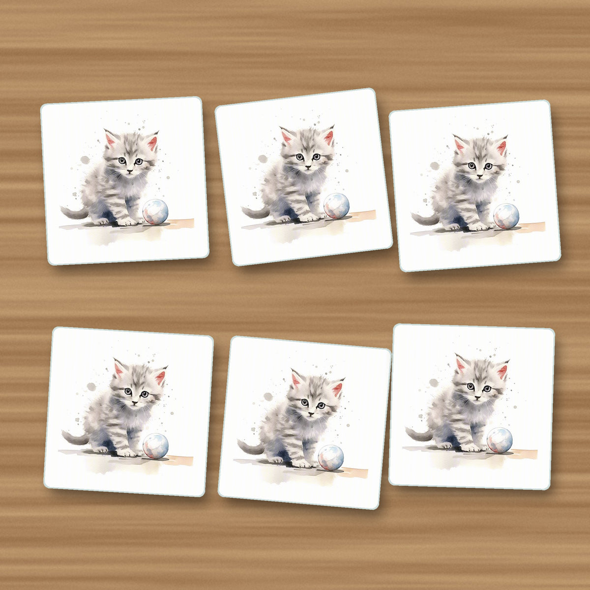 Grey Tabby Kitten with a Ball square glass coasters, set of 6, on an oak coffee table