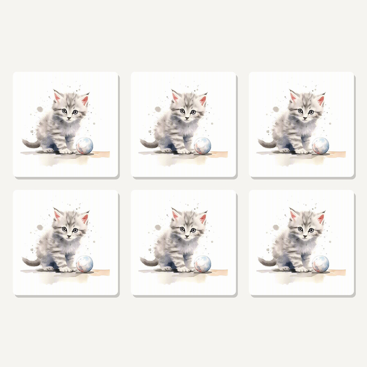 Flat lay of the grey tabby kitten with a ball artwork on six square coasters