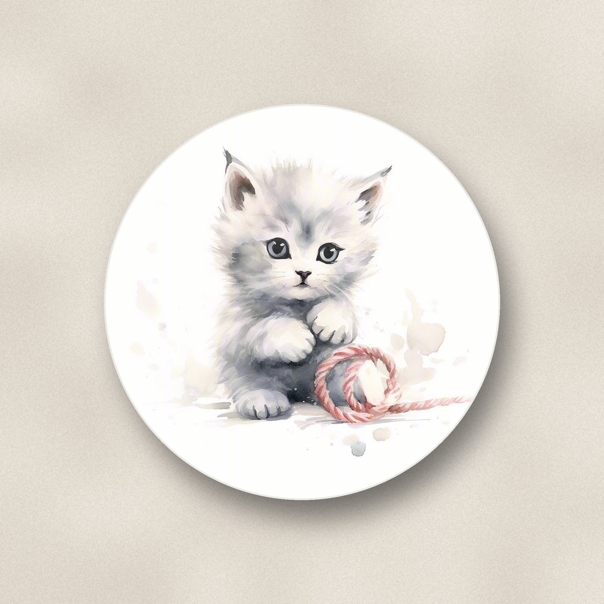 Close-up of one white kitten with yarn round ceramic coaster, flat UV print