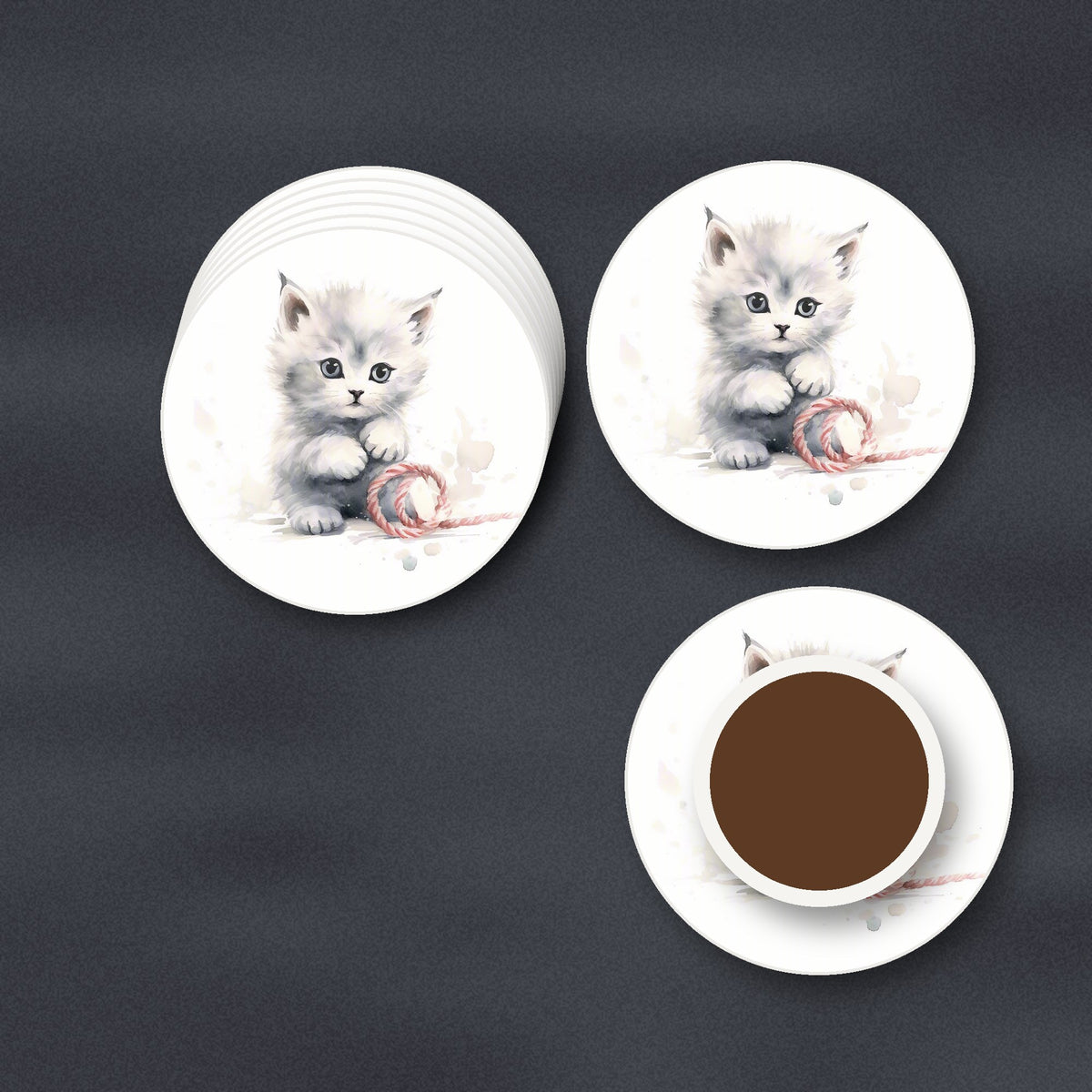 White Kitten with Yarn round ceramic coasters stacked on a slate kitchen worktop